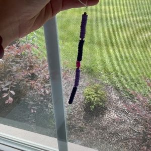 Light, purple, and dark purple Grape in the middle phone charm